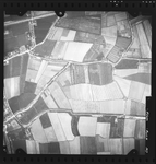 FD-4299-307 Verticale luchtfoto van de Groene Kruisweg, de Werkersdijk, de Jan Cornelispolder, de dorpskern van Rhoon, ...