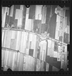 FD-4299-357 Verticale luchtfoto van Barendrecht met de Middeldijk, de Oostweg [Barendrechtseweg], de polder Buitenland ...