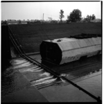 19458 Het onderwaterzetten van de bouwdok voor de bouw van tunnelelementen voor de metro. De werkzaamheden vonden ...
