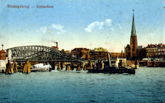 PBK-1987-1099 De Koninginnebrug over de Koningshaven en de spoorbrug. Rechts de toren van de Kerk van de H.H. ...