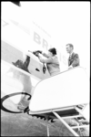 20013-25-13 Doop met champagne van de Carvair Maasbrug van luchtvaartmaatschappij BUAF door wethouder Nancy Zeelenberg ...