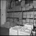 7750 Magazijn met dozen en kisten van het in opspraak geraakte havenbedrijf 'Osto' N.V.