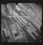 FD-4299-284 Verticale luchtfoto van Ridderkerk met de Dordtschestraatweg, Krommeweg en Voorweg.