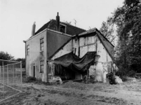 1976-1260 Achterzijde van een woning met nummer 212, 214 en 216 aan de 's-Gravenweg.